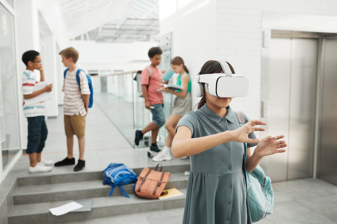 services-02 Group of students exploring virtual reality technology at a modern school setting.